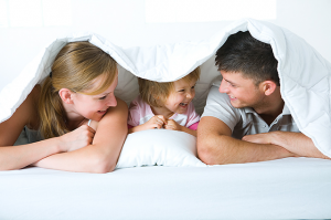 family-under-covers-cA-85620026.png